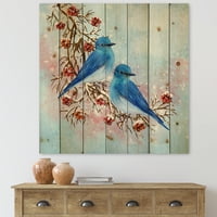 מעצב את 'שתי ציפורים כחולות יושבות על ענף עם פירות יער בחורף' הדפס מסורתי על עץ אורן טבעי